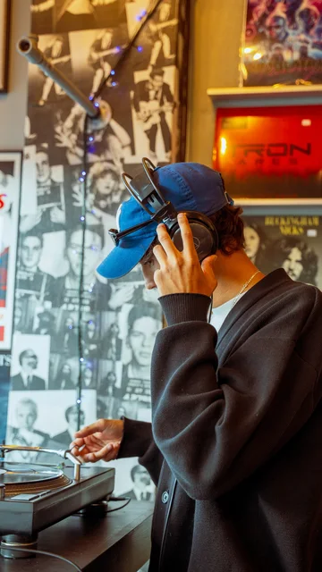 Customer listening to a record in a vinyl shop